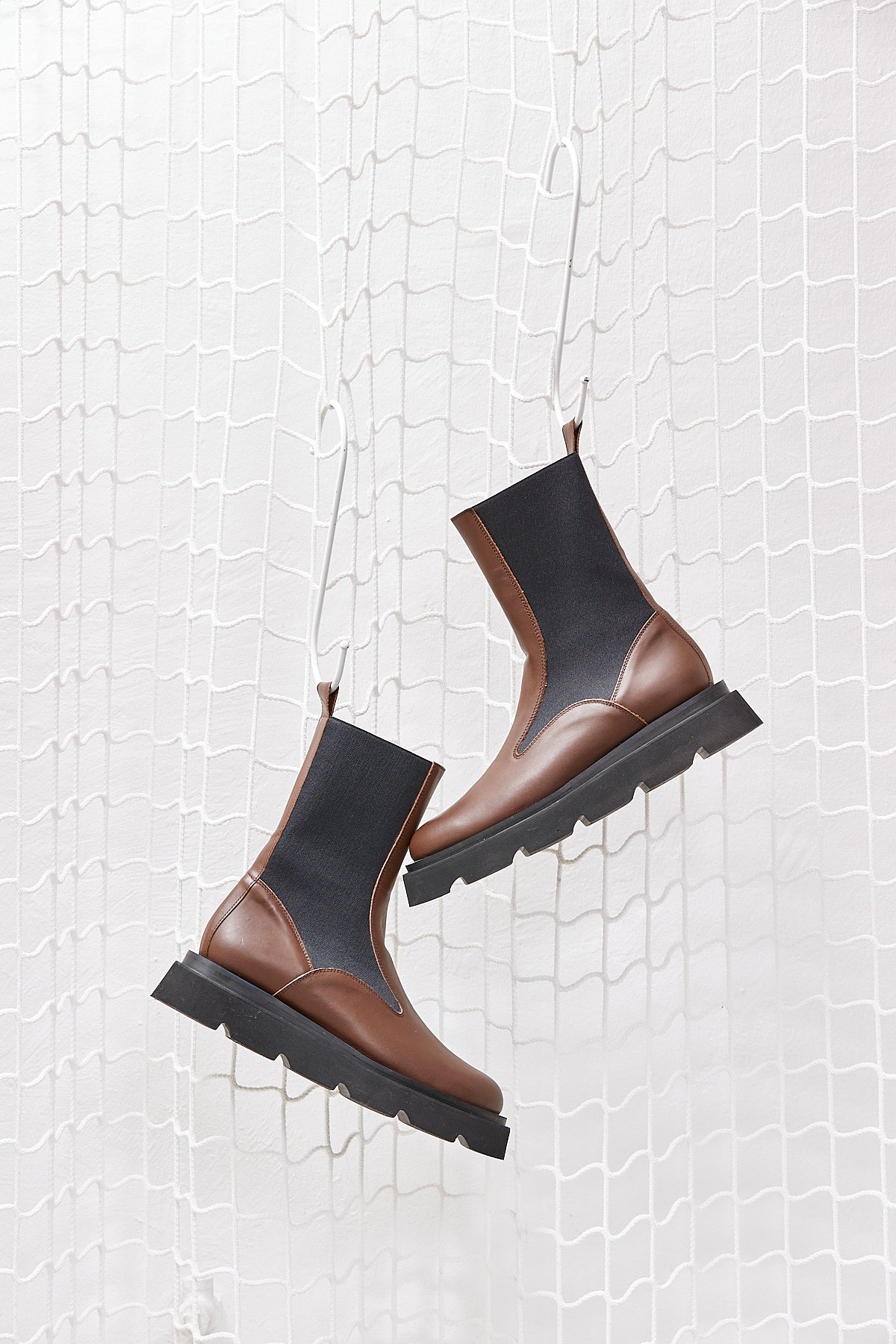 BROWN BOOTS WITH BLACK SOLE